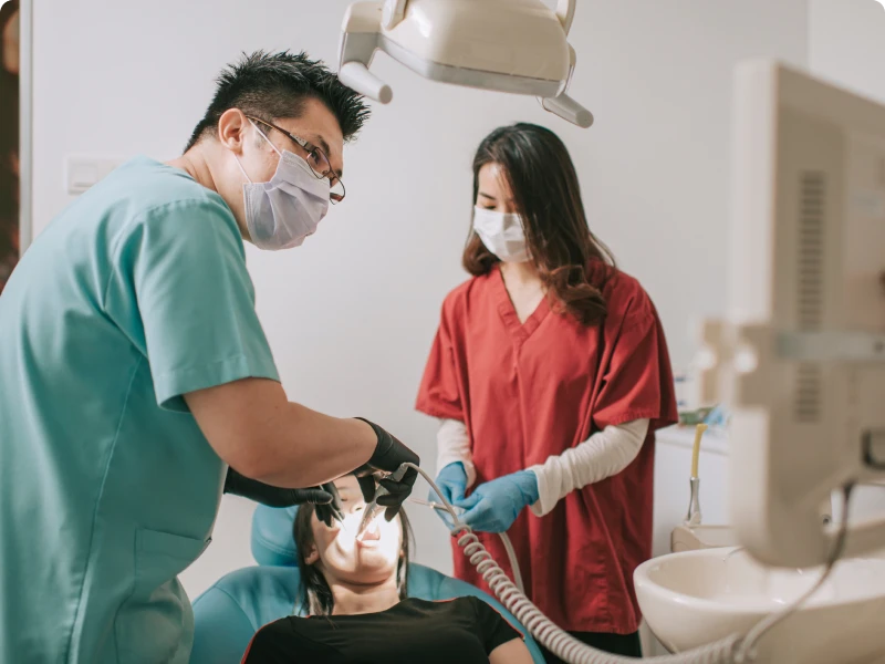 Dentists performing a dental procedure