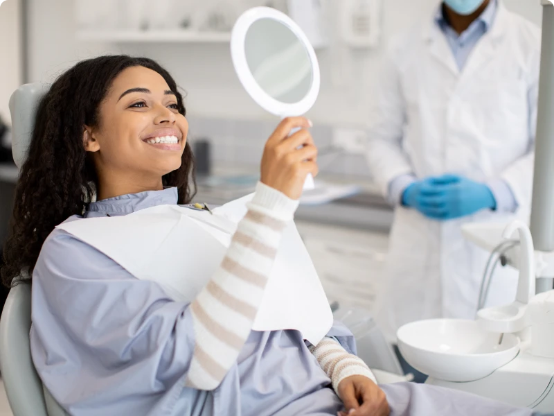 Dentist and satisfied patient interaction